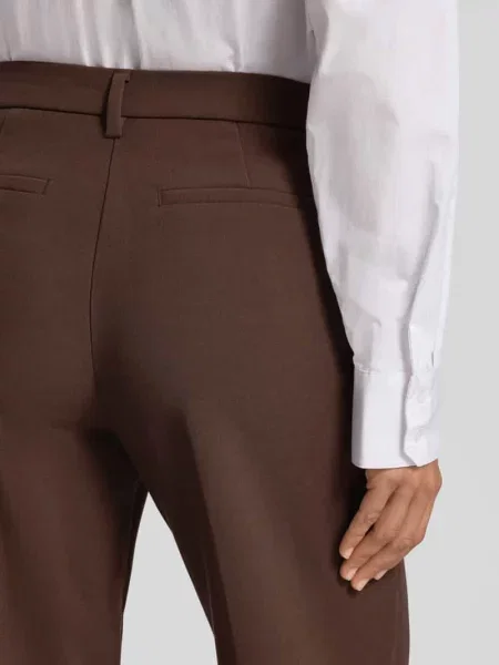 Spodnie o kroju straight fit z wpuszczanymi Christian Berg Woman