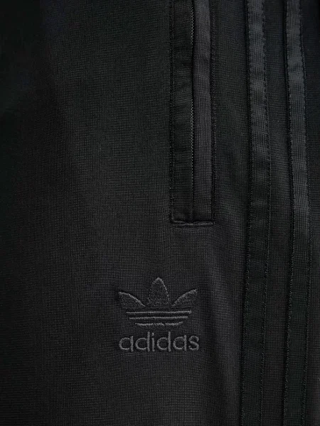 Спортивні штани adidas Originals Firebird з аплікацією чорний