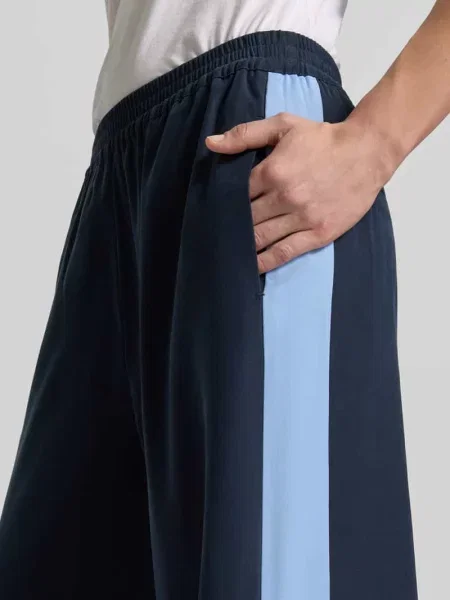 Płynne spodnie z z kontrastowymi lampasami Style Icon Collection granatowe
