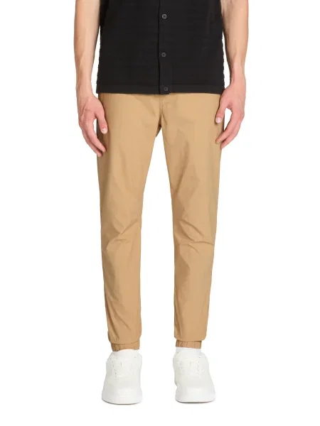 Kalhoty jogger Celio béžové