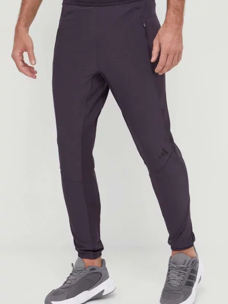 Штани для тренувань adidas Performance однотонні фіолетовий