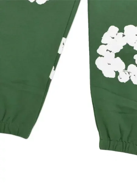 Pantaloni Denim Tears cu model floral cu imagine verde