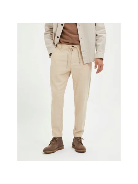 Spodnie o kroju slim taperd fit z tunelem model ‘Brody’ Selected Homme beżowe