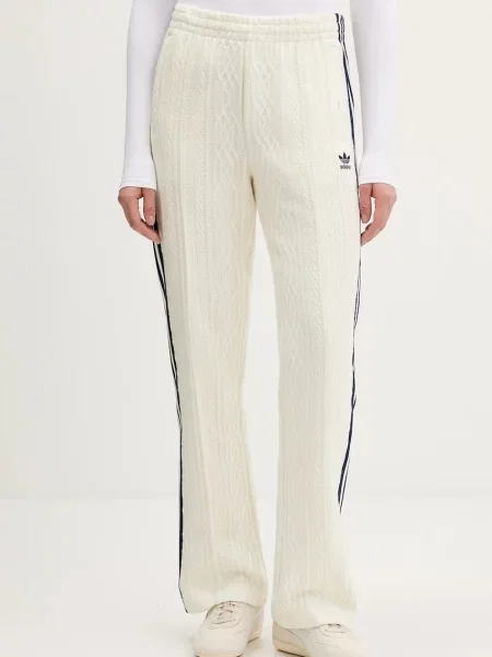 Adidas Originals spodnie dresowe beżowy z aplikacją granatowe