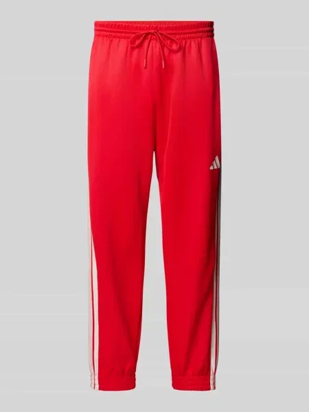 Spodnie dresowe z logo i elastycznym pasem Adidas Sportswear czerwony