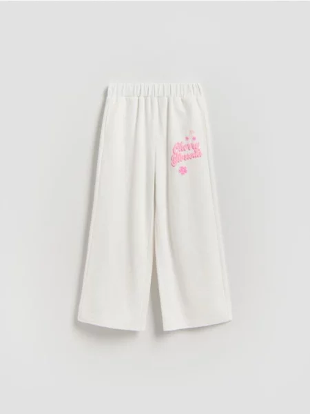 Reserved Спортивні штани з принтом кремовий 