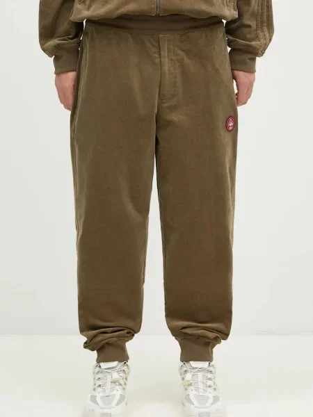 Donji dio trenirke adidas Originals bez uzorka zelena