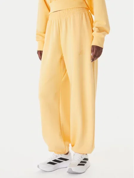 Adidas Spodnie dresowe Soft Lux pomarańczowy