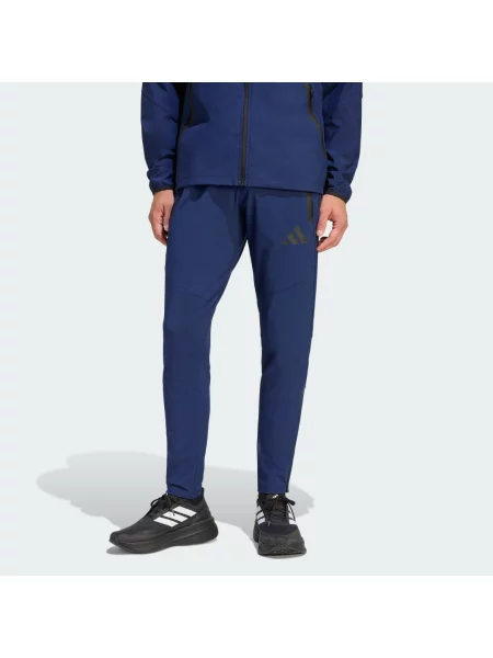 Kalhoty Tiro Travel Woven Pants černé