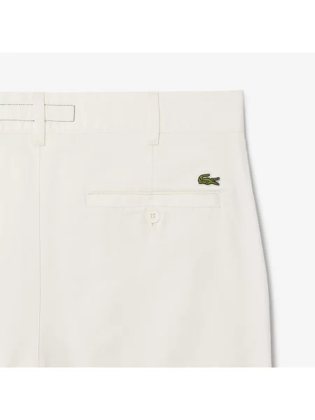 Сhinosy Lacoste białe