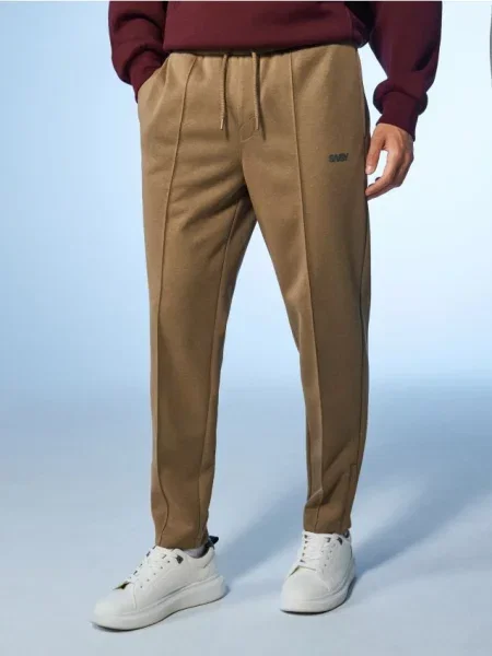 Sinsay Spodnie tapered fit beżowy