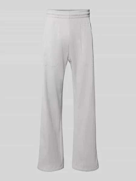 Spodnie dresowe o kroju straight fit z fakturowanym wzorem Model „Essentials” Adidas Originals