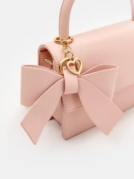 Сумка з бантом і декоративною підвіскою у формі серця пастельний рожевий
