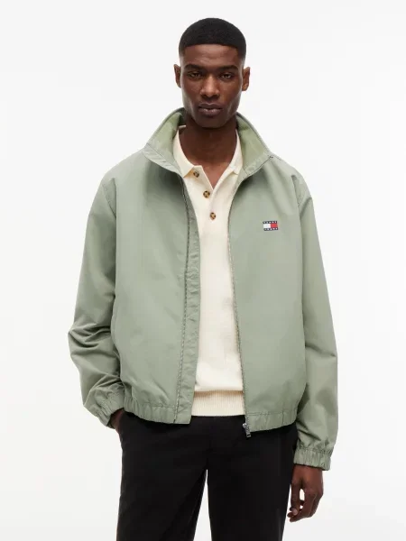 Tommy Jeans Prechodná bunda ESSENTIAL pastelovo zelená