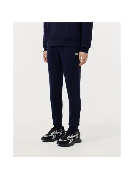 Długie spodnie w kolorze granatowym Lacoste Style XS niebieskie