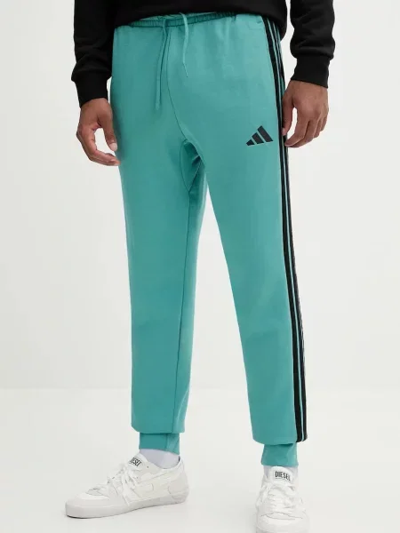 Adidas spodnie dresowe Essentials turkusowy z aplikacją niebieskie