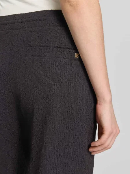 Spodnie dresowe o kroju regular fit z wzorem na całej powierzchni model NAYENE' Hugo czarny