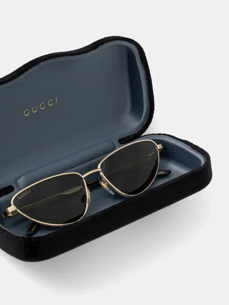Солнцезащитные очки Gucci золотые