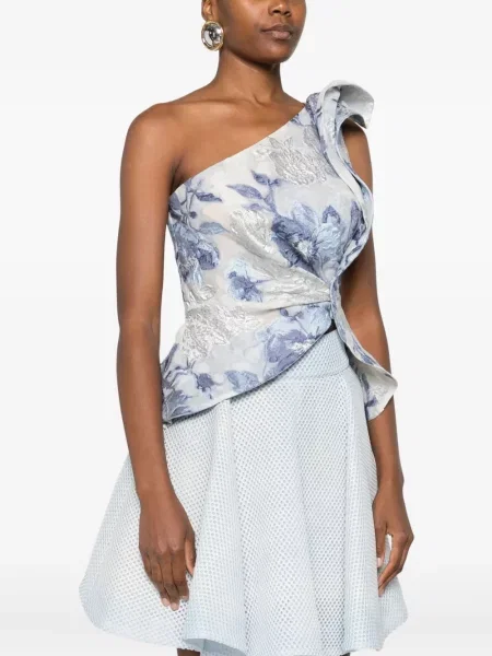 Bluzka Gemy Maalouf w kwiatki z nadrukiem na jednym ramieniu niebieska