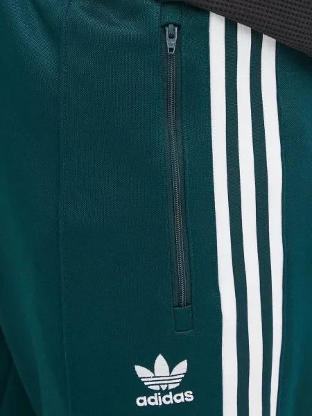 Спортивні штани adidas Originals Denim TP з аплікацією зелений