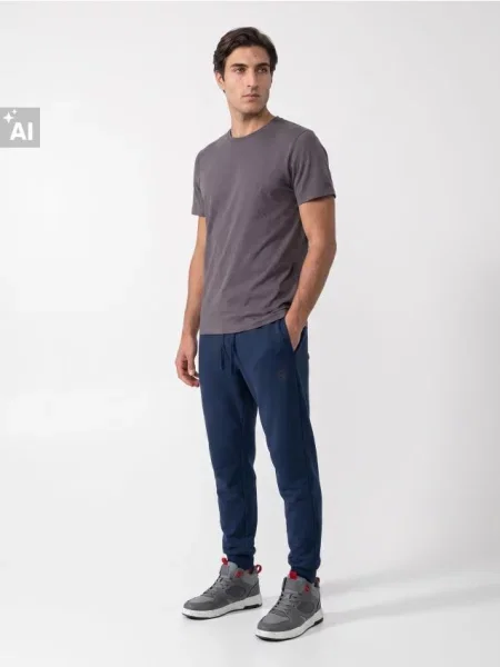 Sinsay Teplákové kalhoty comfort fit s příměsí bavlny modrá