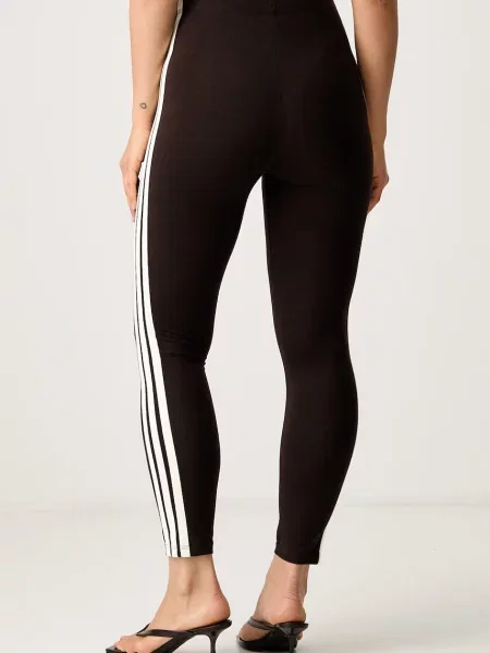 Adidas legginsy Essentials brązowe