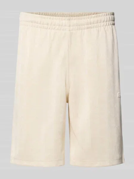 Szorty dresowe o kroju regular fit z nadrukiem monogramu i logo Lacoste