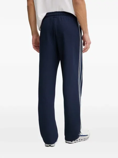 Pantaloni Guess cu dungi alergare albastru