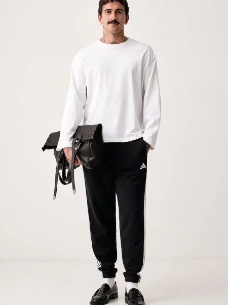 Adidas pantaloni de trening pentru bărbați din Essentials negru
