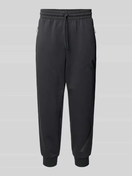 Spodnie dresowe z logo i elastycznym pasem Adidas Sportswear czarny