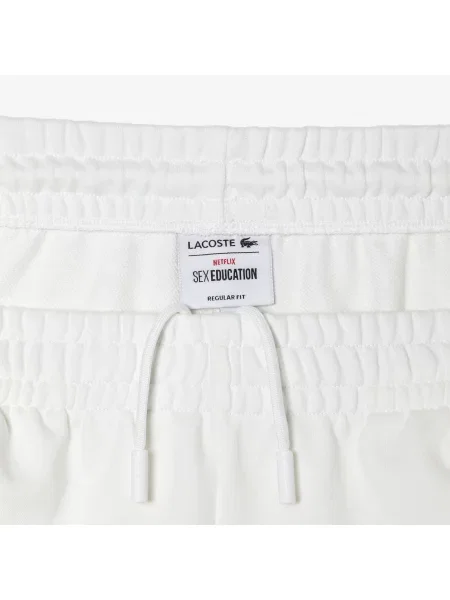 Lacoste Spodnie Dresowe X Netflix Z Nadrukiem Krokodylej Skóry białe