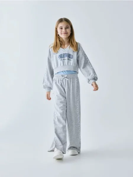 Reserved Spodnie dresowe SmileyWorld® jasnoszary