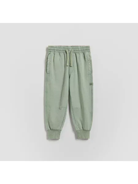 Reserved kalhoty joggers bledá zelená