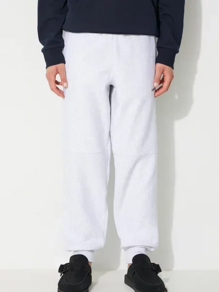 Tepláky Carhartt WIP American Script Jogging Pant melanžové šedá