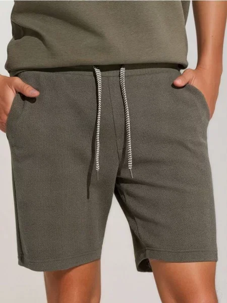 Sinsay Kraťasy s ozdobným vázáním tmavě zelená