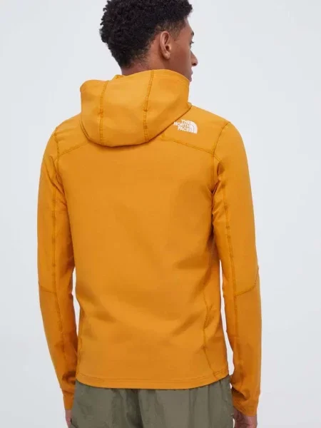 Mikina The North Face s kapucí hladká žlutá