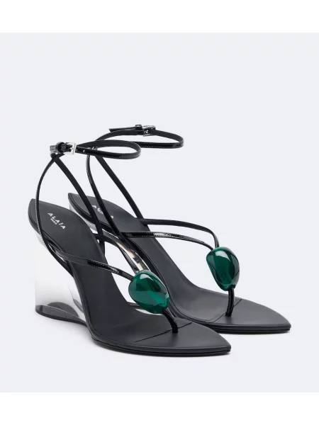 Chiloți tanga Alaïa din piele cu pană negru
