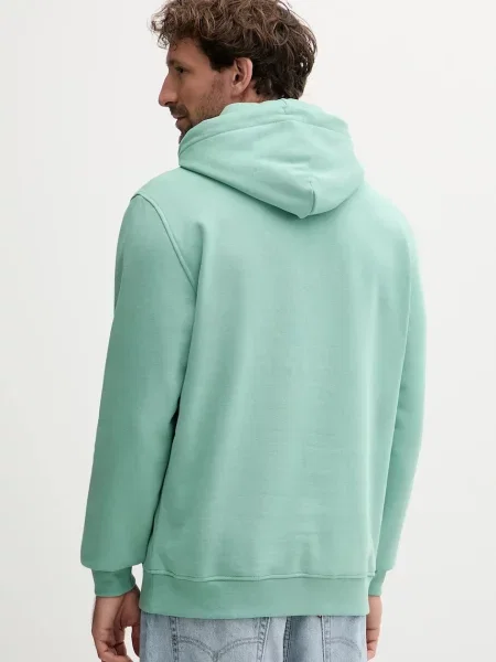 Tommy Jeans pulover s kapuco z bombažem zelena