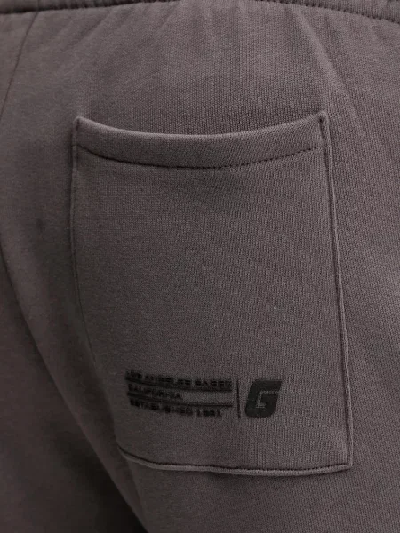 Спортивні штани Guess EMIS з принтом чорний