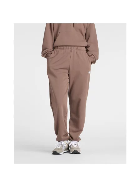 Spodnie długie New Balance Sport Essentials French Terry Jogger L brązowe