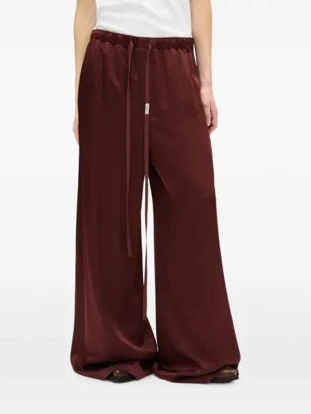 Pantaloni Ann Demeulemeester din satin cu cordon roșu