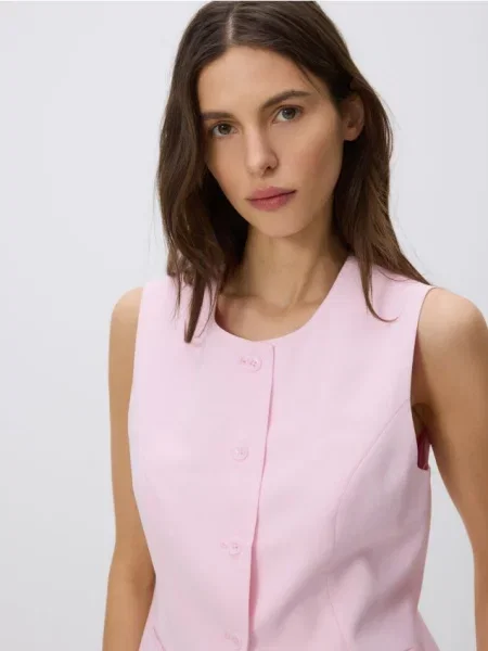 Reserved Vestă cu adaos de roz