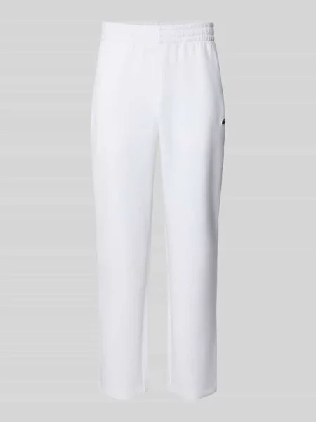 Spodnie dresowe o kroju tapered z dodatkiem bawełny Lacoste Sport białe