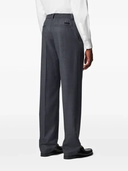 Pantaloni Versace de lână în carouri gri