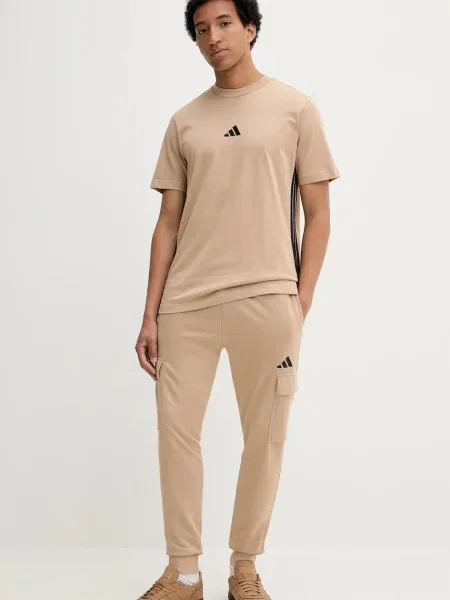 Спортивні штани adidas Feelcozy однотонні бежевий