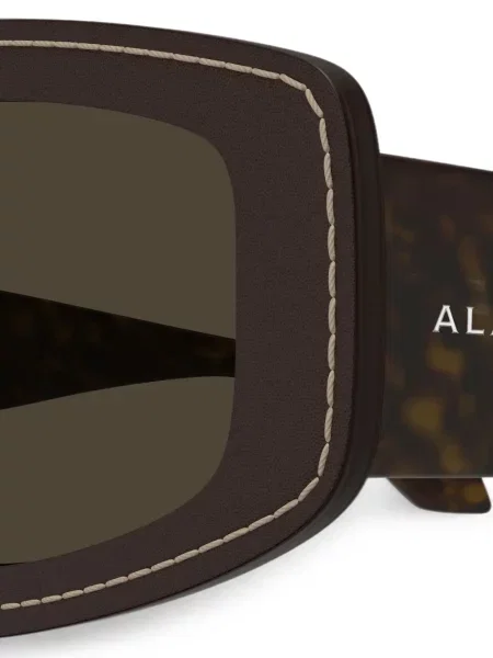 Saulės akiniai Alaia Eyewear ruda