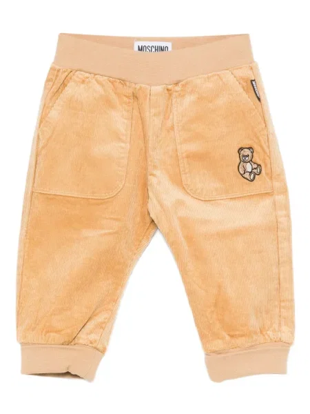 Spodnie dziecięce Moschino pomarańczowe