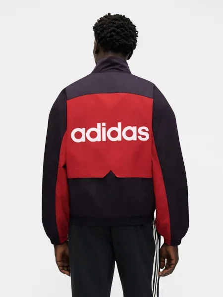 ADIDAS ORIGINALS Prechodná bunda Munich červená / čierna biela