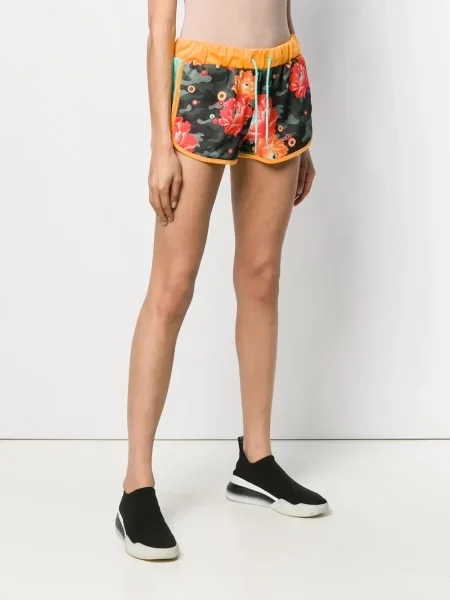 Pantaloni scurți Puma cu model floral cu imagine verde