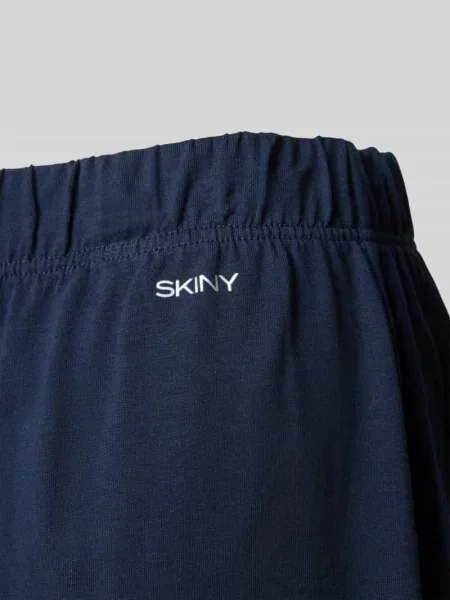 Spodnie od piżamy o kroju relaxed fit z nadrukiem z logo Skiny granatowe